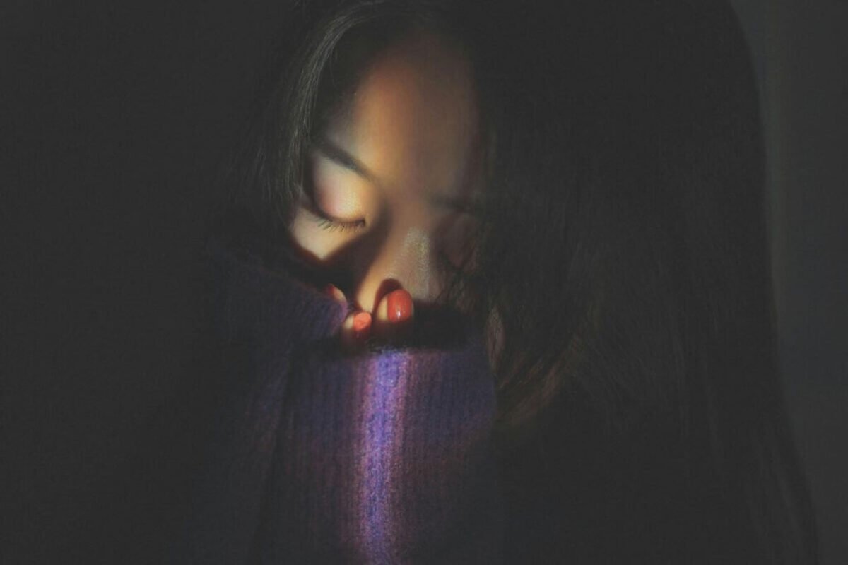 Woman covering her face in emotional distress, representing depression as a Christian and seeking hope