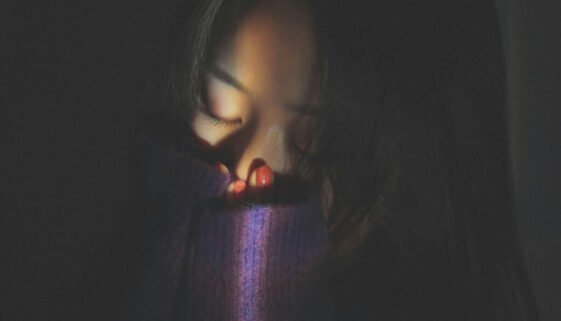 Woman covering her face in emotional distress, representing depression as a Christian and seeking hope